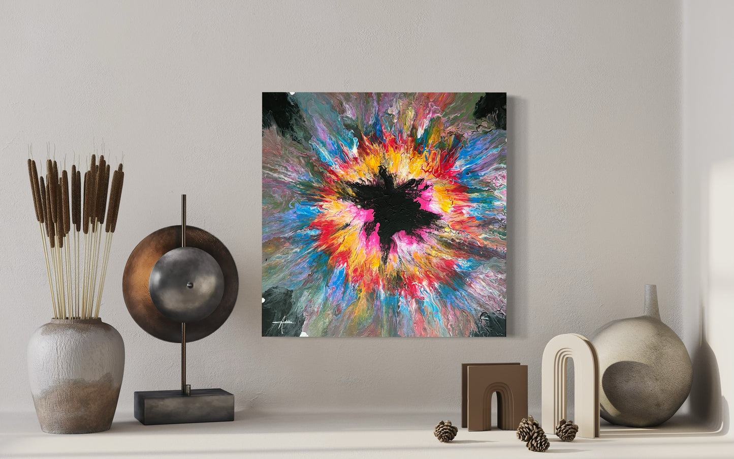 Abstract acrylic painting with an explosive burst of color in yellow, pink, blue and red on a black background - modern fluid art artwork with a central black element and powerful energy.