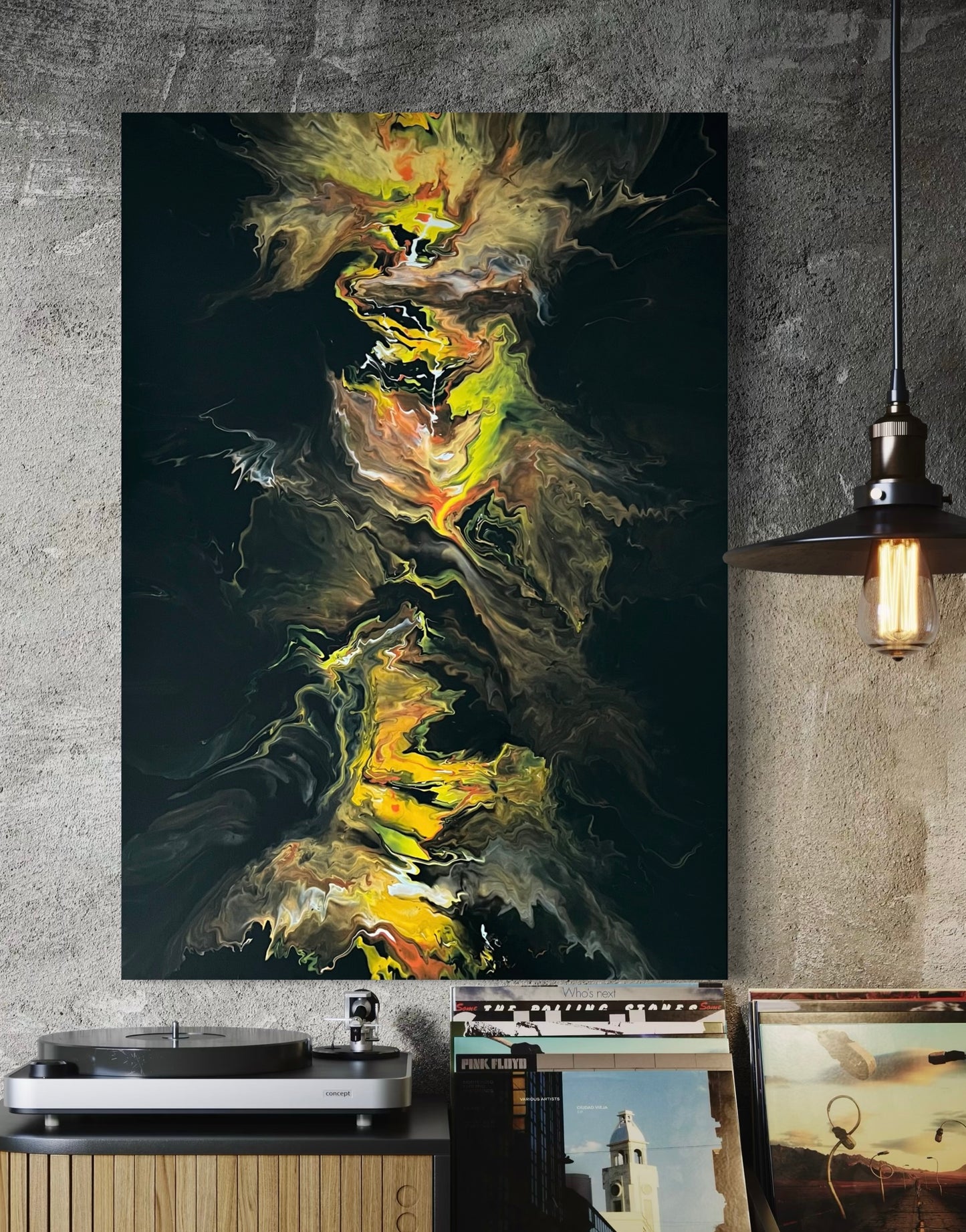 Abstract acrylic painting with bright yellow, orange and black tones in a vertical flow technique - expressive fluid art artwork with fiery dynamics on a black background.
