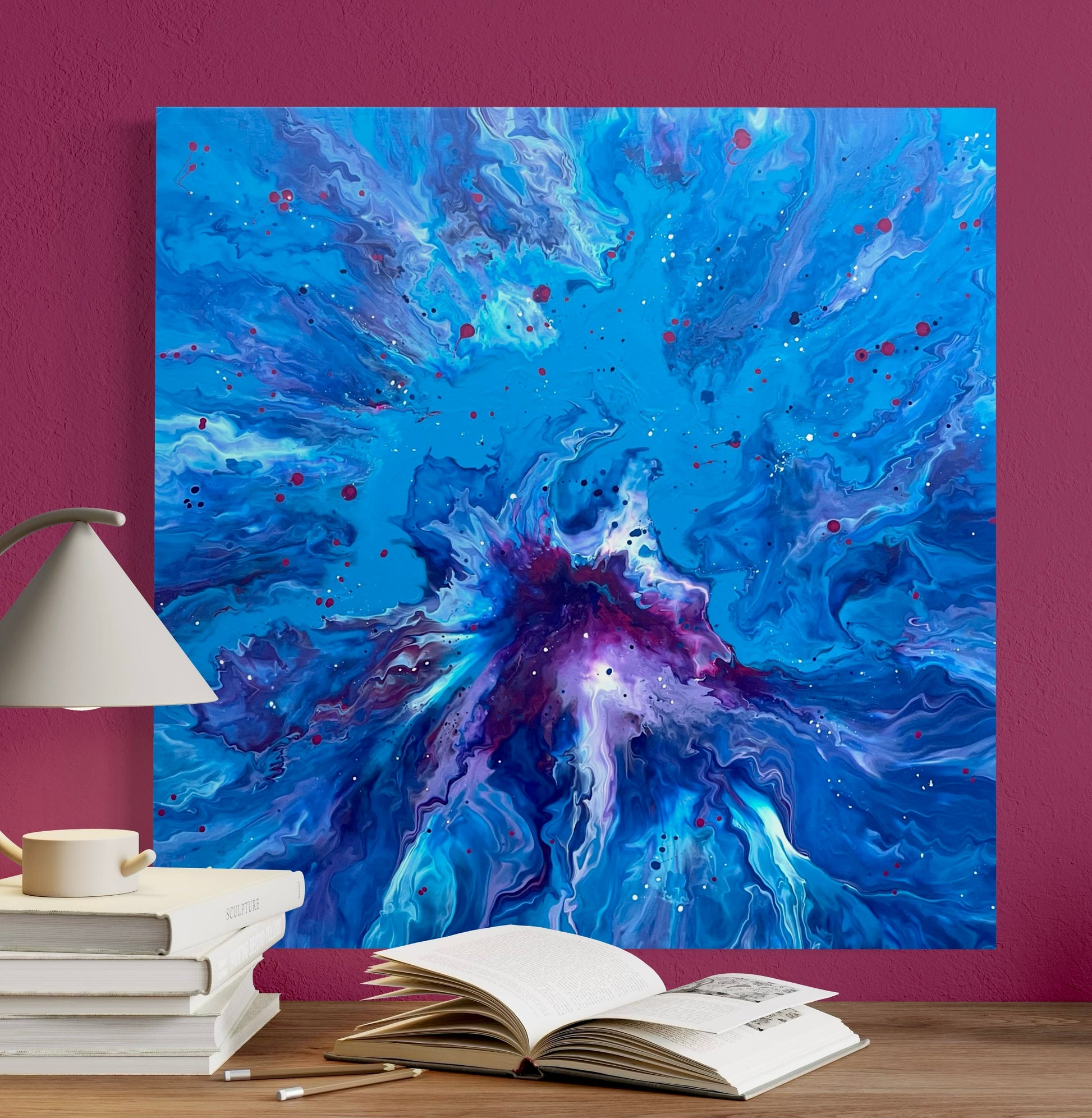 Abstract acrylic painting in intense shades of blue with a violet center, dynamic flowing structures and colorful speckles - modern fluid art artwork with a cosmic effect on a blue background.