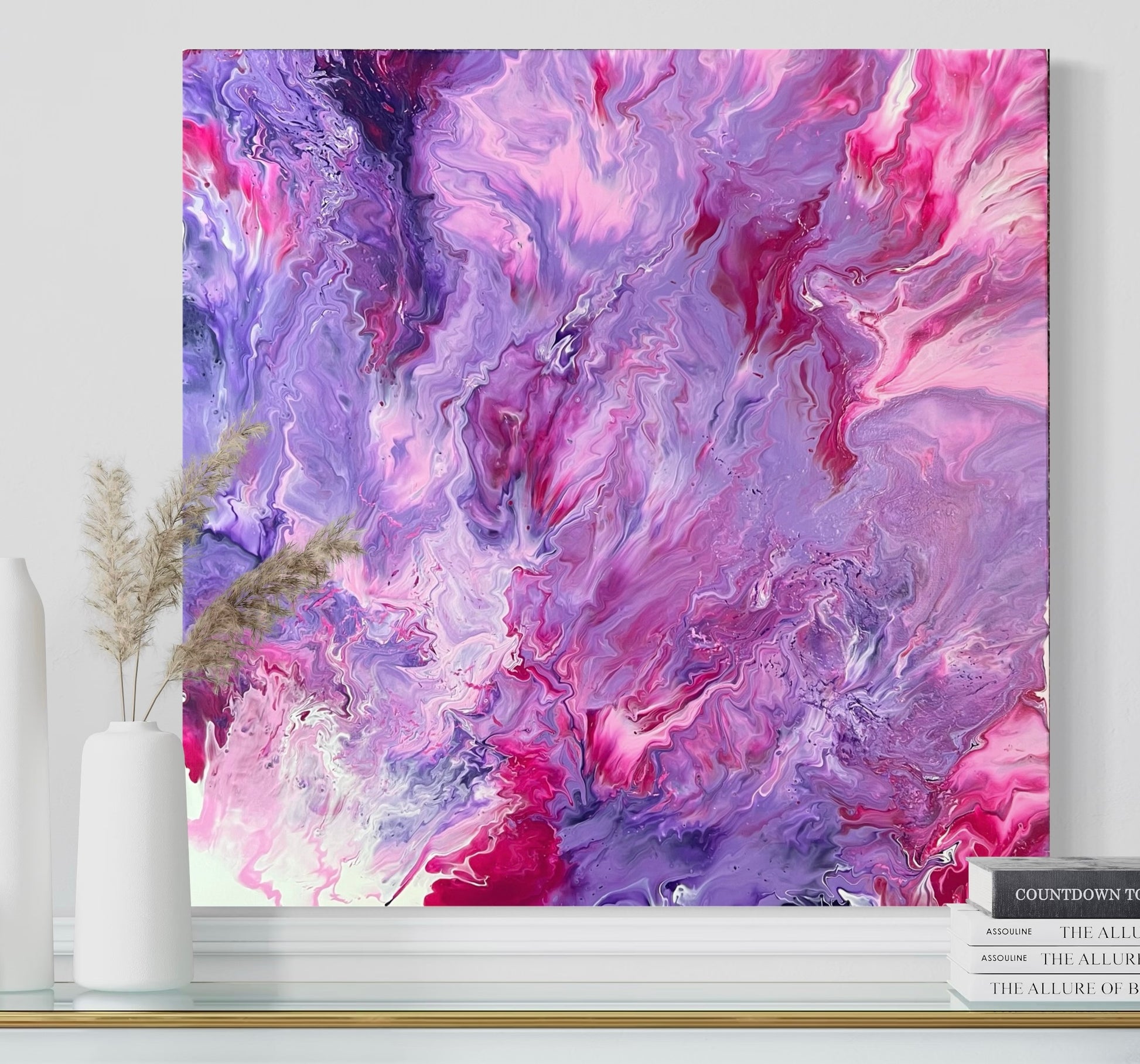 Abstract acrylic painting in intense shades of pink, purple, and violet with soft, flowing color gradients and a dynamic depth effect. The harmonious composition is reminiscent of clouds, flowers, or movement in water and creates an atmosphere that is both powerful and calming. Hand-painted, one-of-a-kind piece in the fluid art style—modern abstract art on canvas, ideal as an elegant eye-catcher in contemporary interior design.