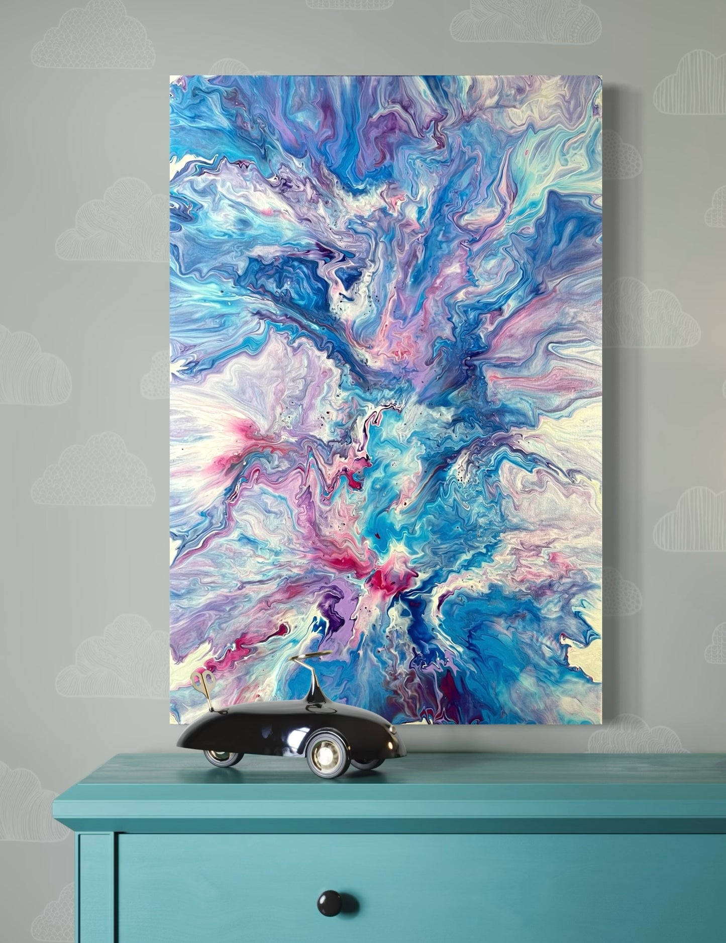 Expressive acrylic painting with marbled structures in shades of blue, turquoise, purple and pink on canvas - abstract wall art in a modern living style with fluid art technique.