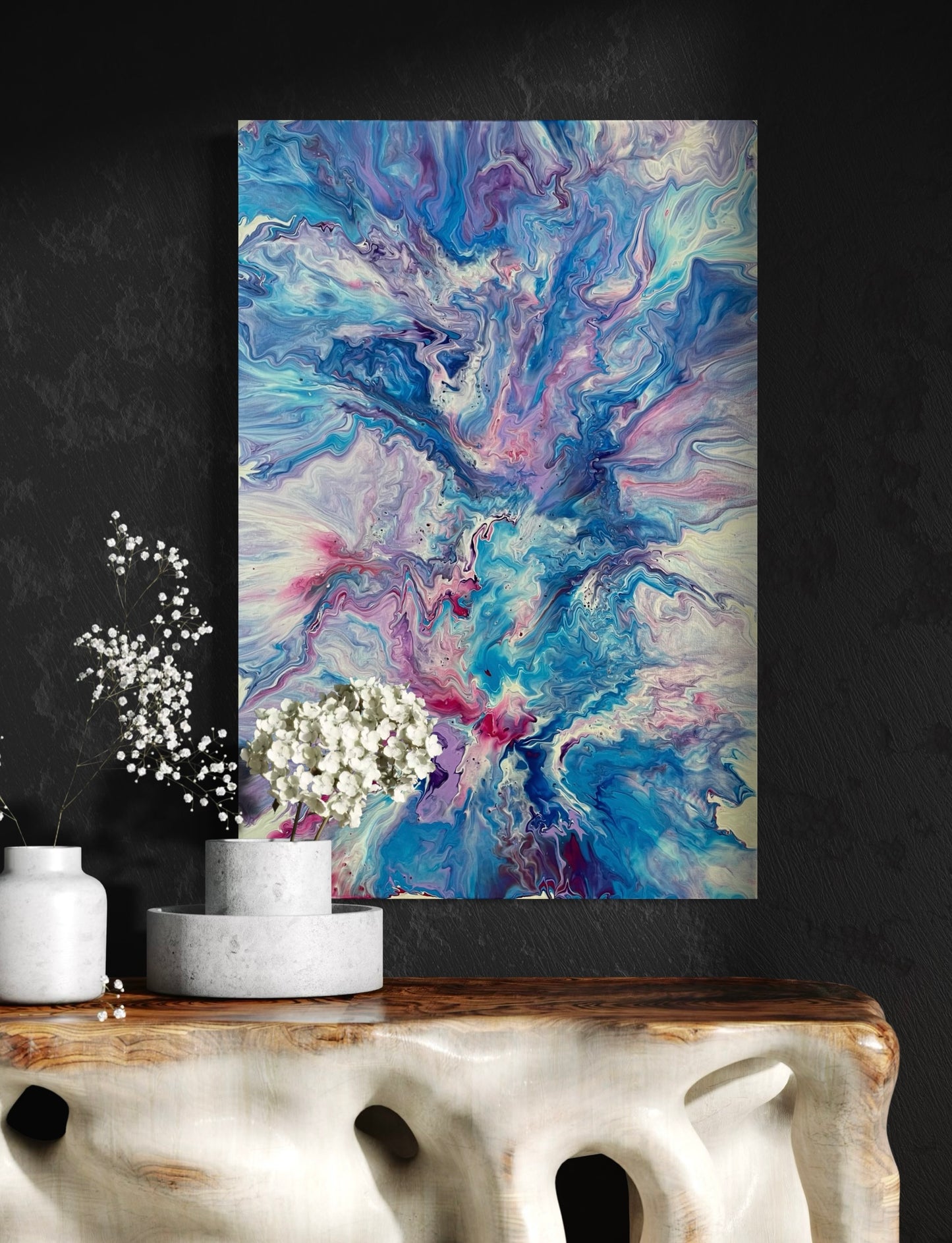 Expressive acrylic painting with marbled structures in shades of blue, turquoise, purple and pink on canvas - abstract wall art in a modern living style with fluid art technique.