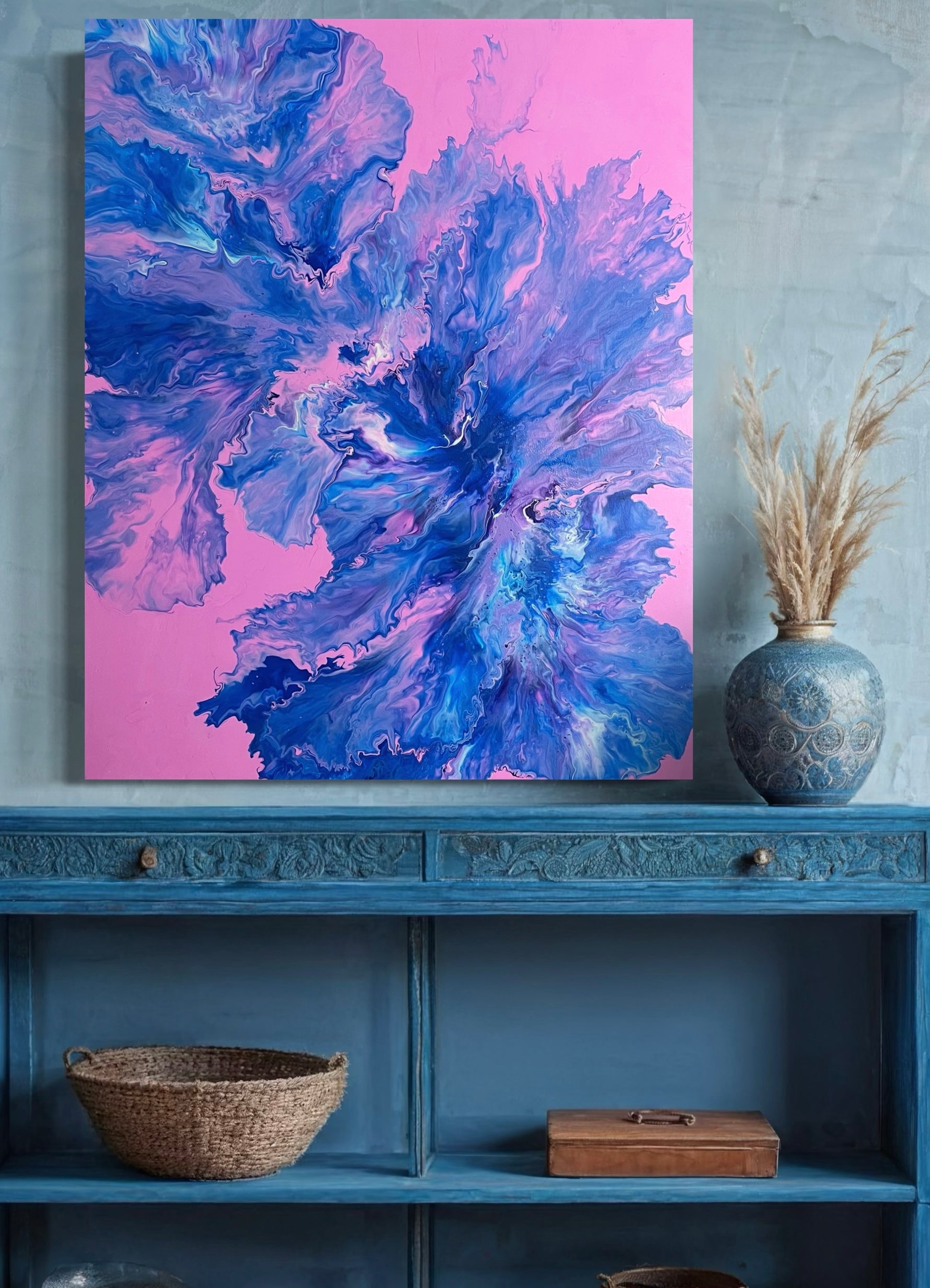 Abstract acrylic painting with vivid blue, purple and turquoise tones on a pink background - modern fluid art artwork with dynamic flowing structures for creative wall design.
