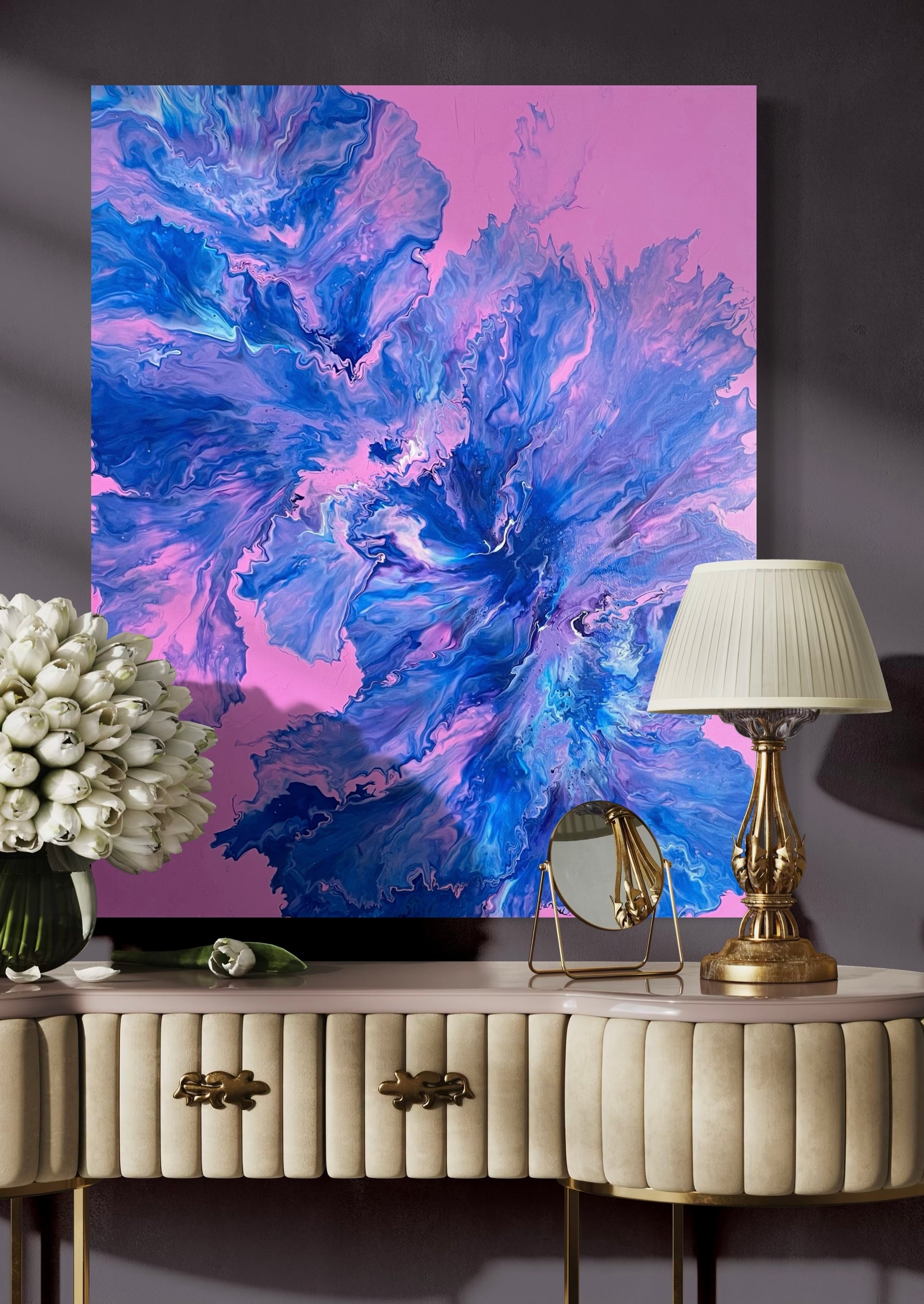 Abstract acrylic painting with vivid blue, purple and turquoise tones on a pink background - modern fluid art artwork with dynamic flowing structures for creative wall design.