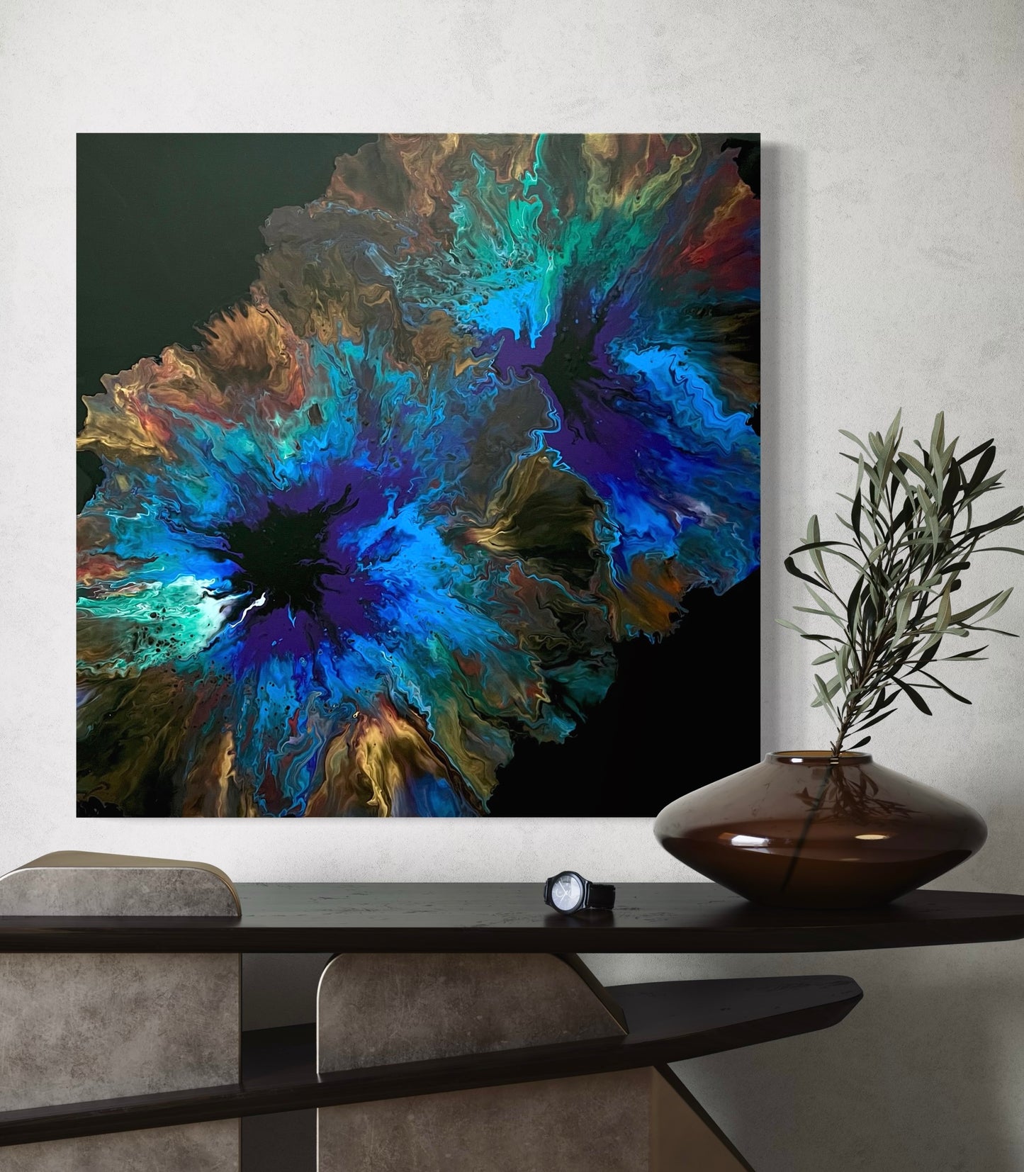 Abstract acrylic painting in intense shades of blue, turquoise, gold, and brown with contrasting, explosive color gradients. The composition is reminiscent of cosmic energy, deep oceans, or forces of nature, drawing the eye to its center with its depth and luminosity. Hand-painted, one-of-a-kind piece in the fluid art style—modern abstract art on canvas, ideal as an expressive eye-catcher in elegant living rooms and gallery spaces.