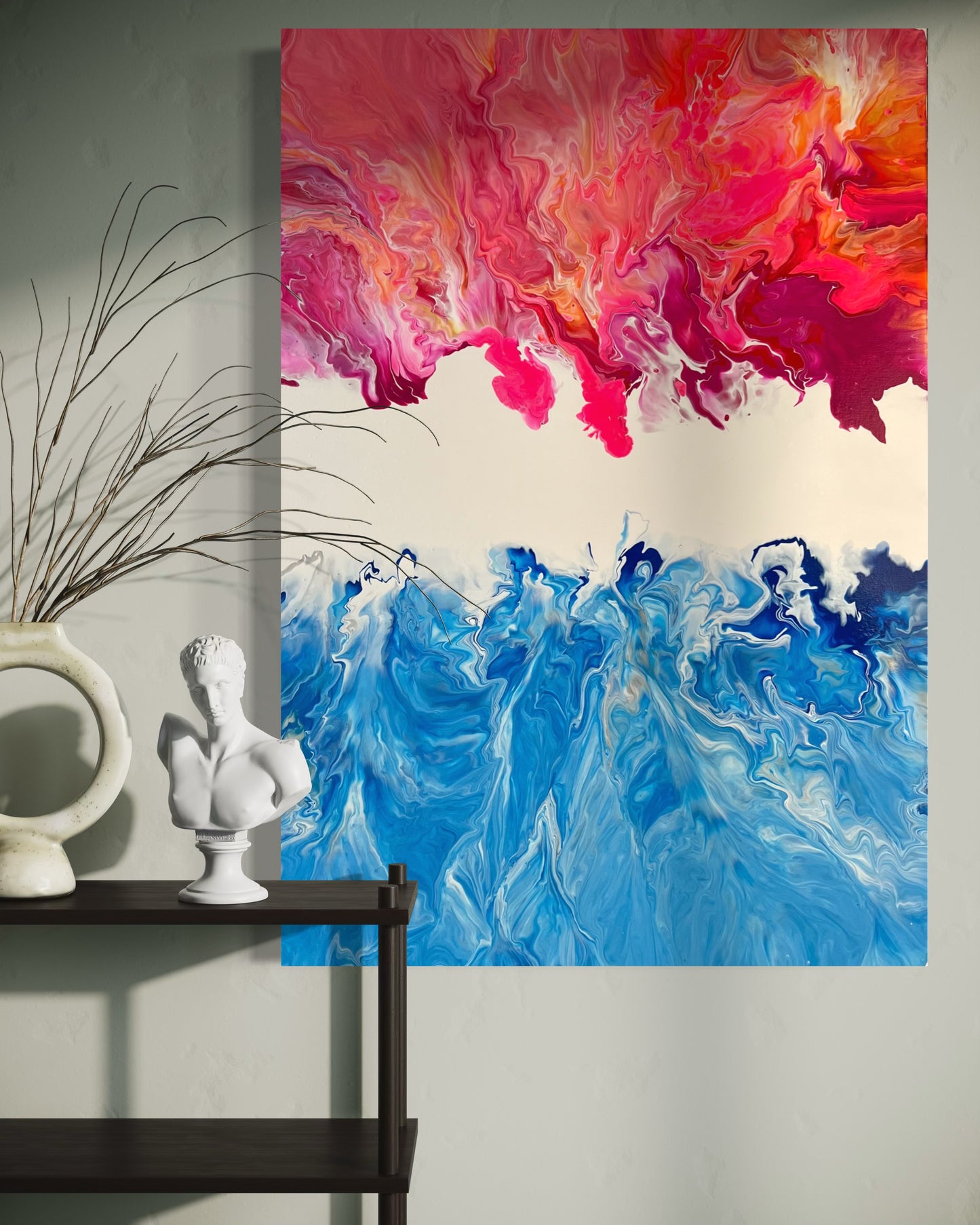Abstract acrylic painting in vibrant shades of blue, pink, and orange, combining the dynamism of fire and water in flowing forms. The upper half of the painting features warm, fiery color gradients, while the lower blue tones are reminiscent of waves or ocean movements. Hand-painted, one-of-a-kind piece in the fluid art style—modern abstract art on canvas with strong expressiveness and harmonious color contrast, ideal as an eye-catcher in contemporary spaces.